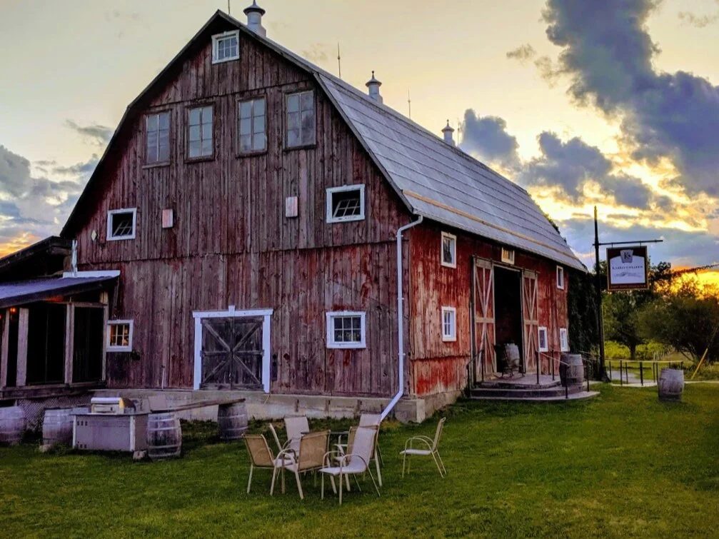 The 1805 timber barn at Karlo Estates at dusk